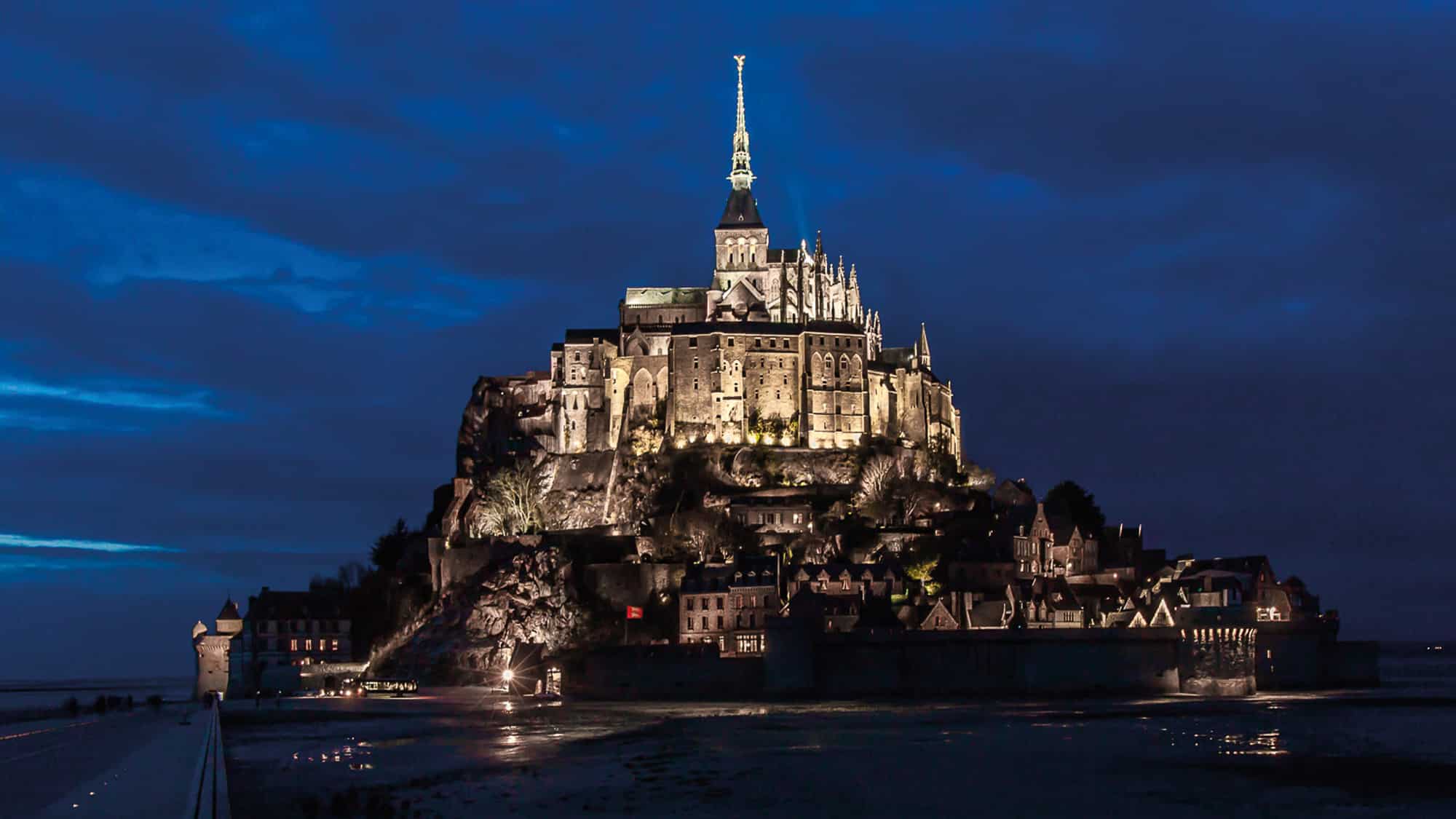 Mont Saint Michael rises from the water forming one of the best islands to visit at high tide