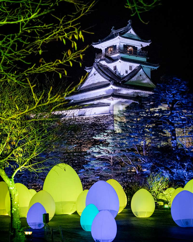 Kōchi Castle illuminated in the various colours of projection