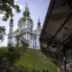 A cathedral in Kyiv Ukraine framed by an art stool on the bottom right