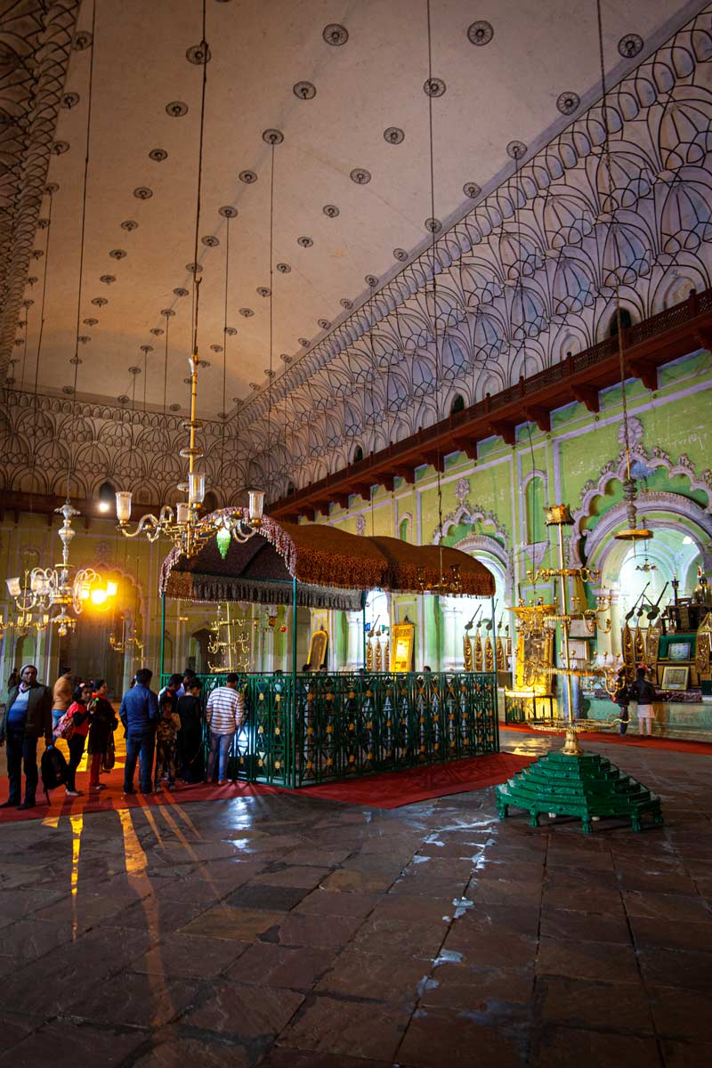 Inside the Bara Imambara in Lucknow is a detailed hall where people line up to pray