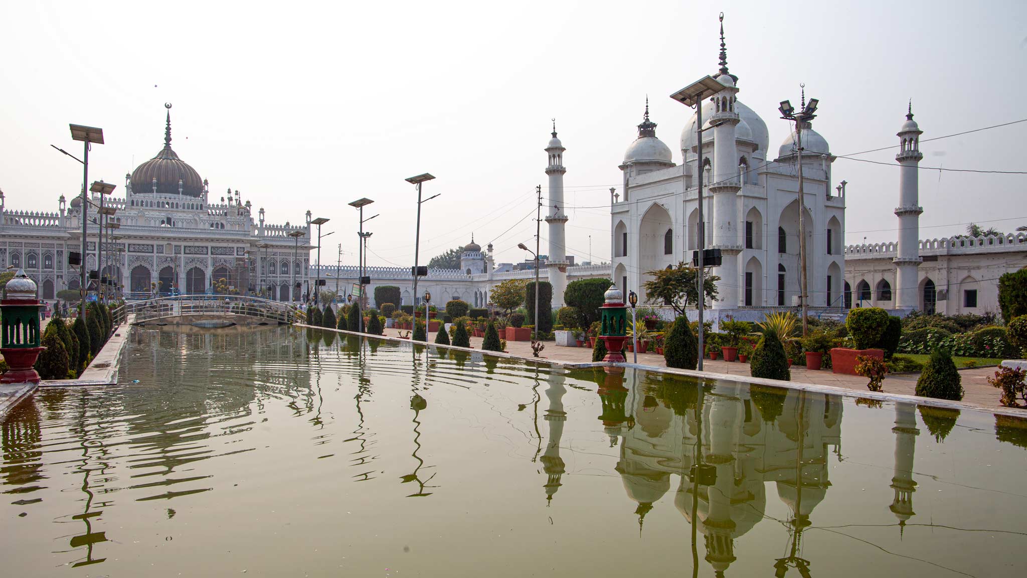 Reflections of the white mosque on a smoggy day