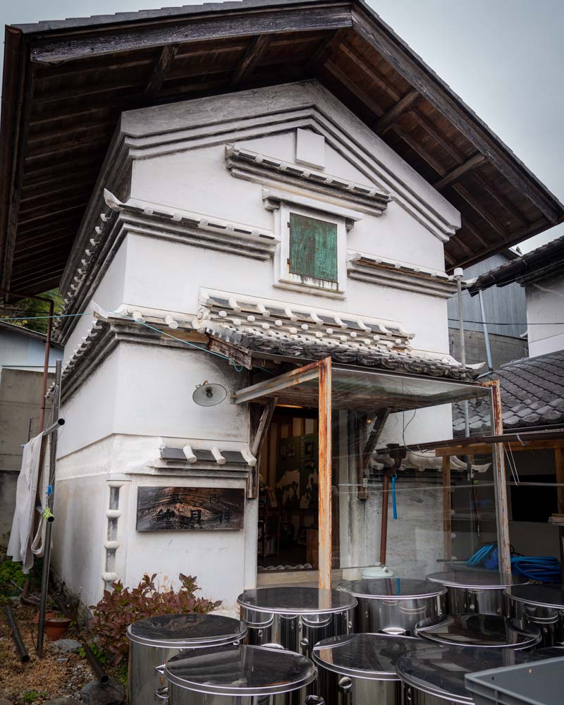 A traditional Sake workroom, with barrels outside