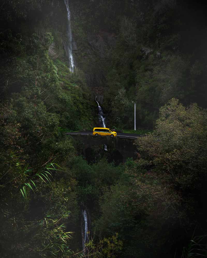 A yellow taxi in a waterfall at Madeira