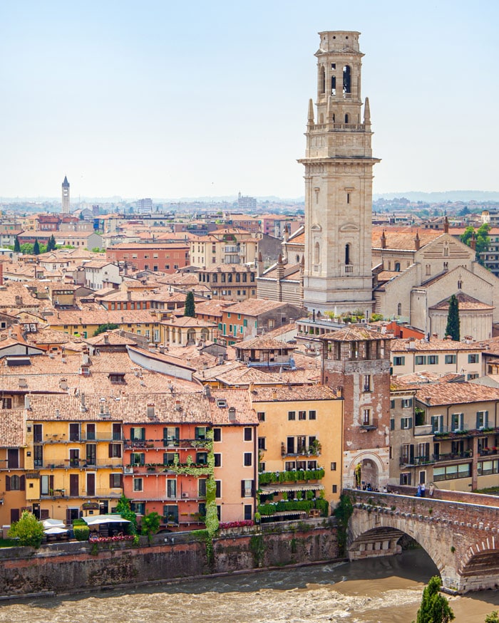 A view of Veronas river, tower and rooftops